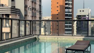Outdoor pool, open 5:00 AM to 10:00 PM, pool umbrellas