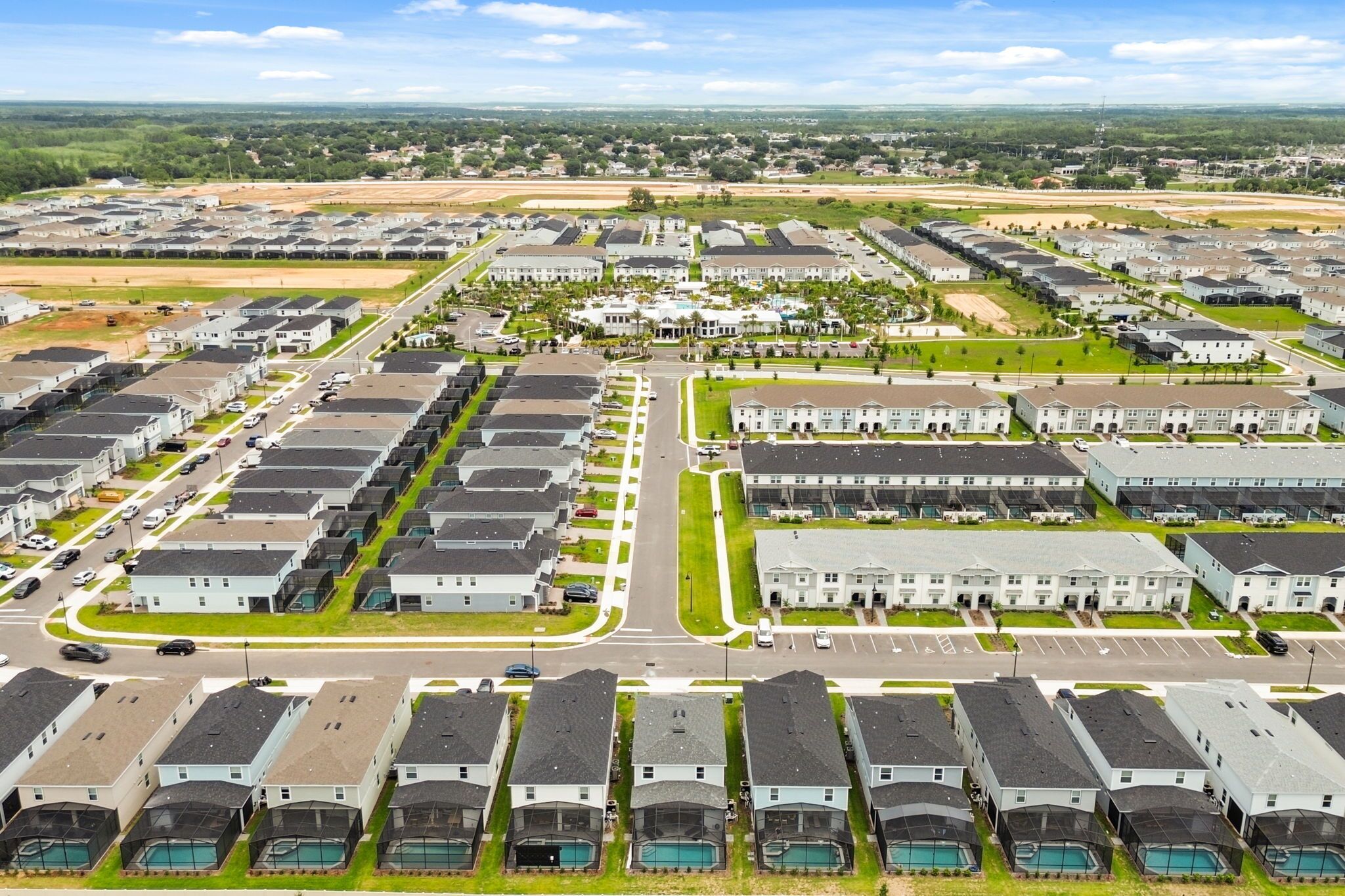 Un quartier résidentiel comprenant plusieurs immeubles d’appartements, des rues et des espaces verts.