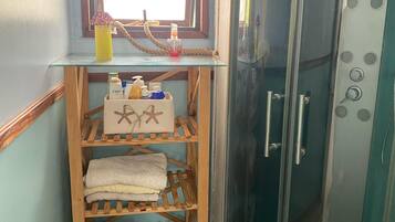 Jetted tub, hair dryer, soap, toilet paper