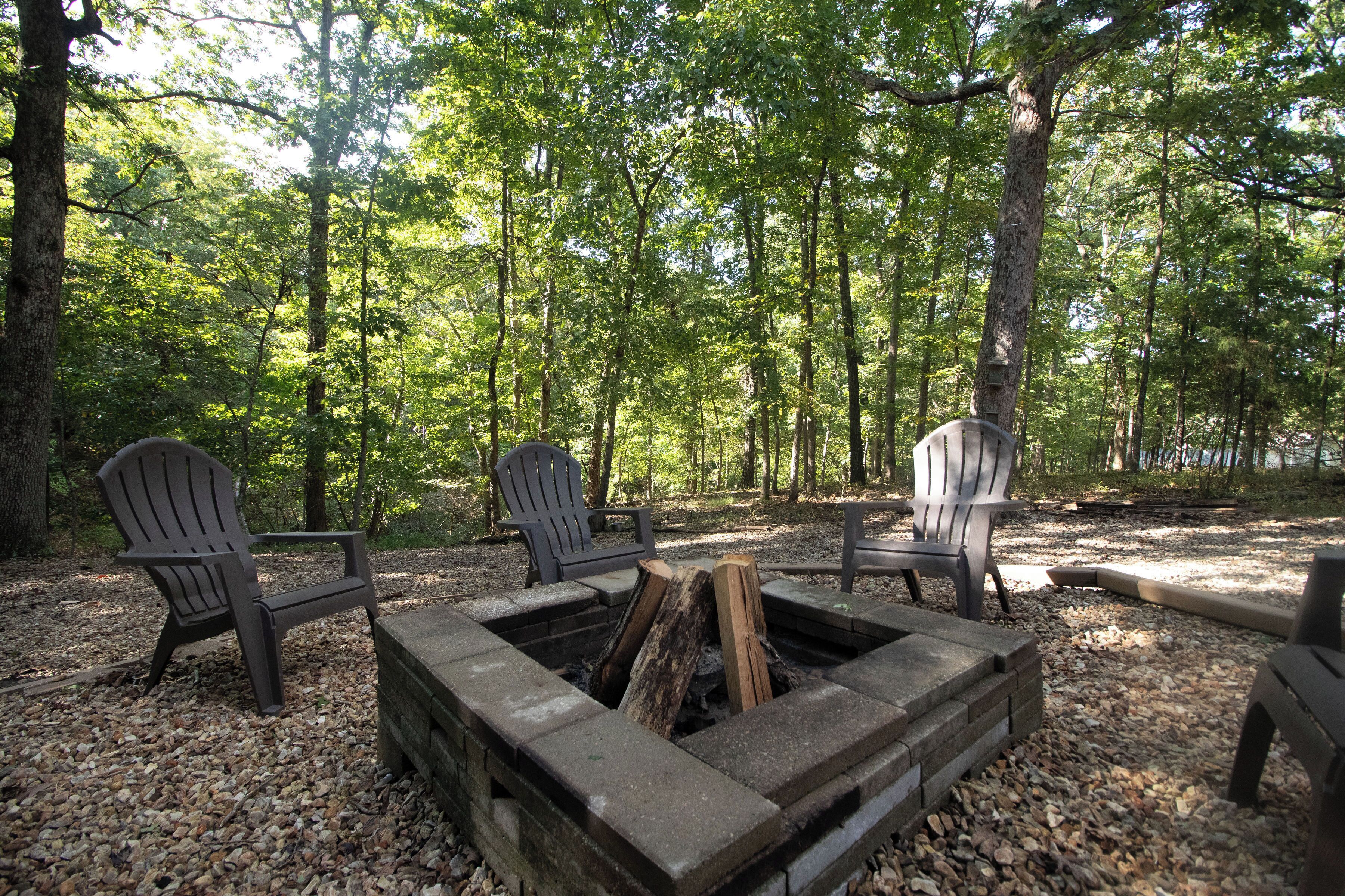 Private woodland fire pit with Adirondack seating—s’mores under the trees!