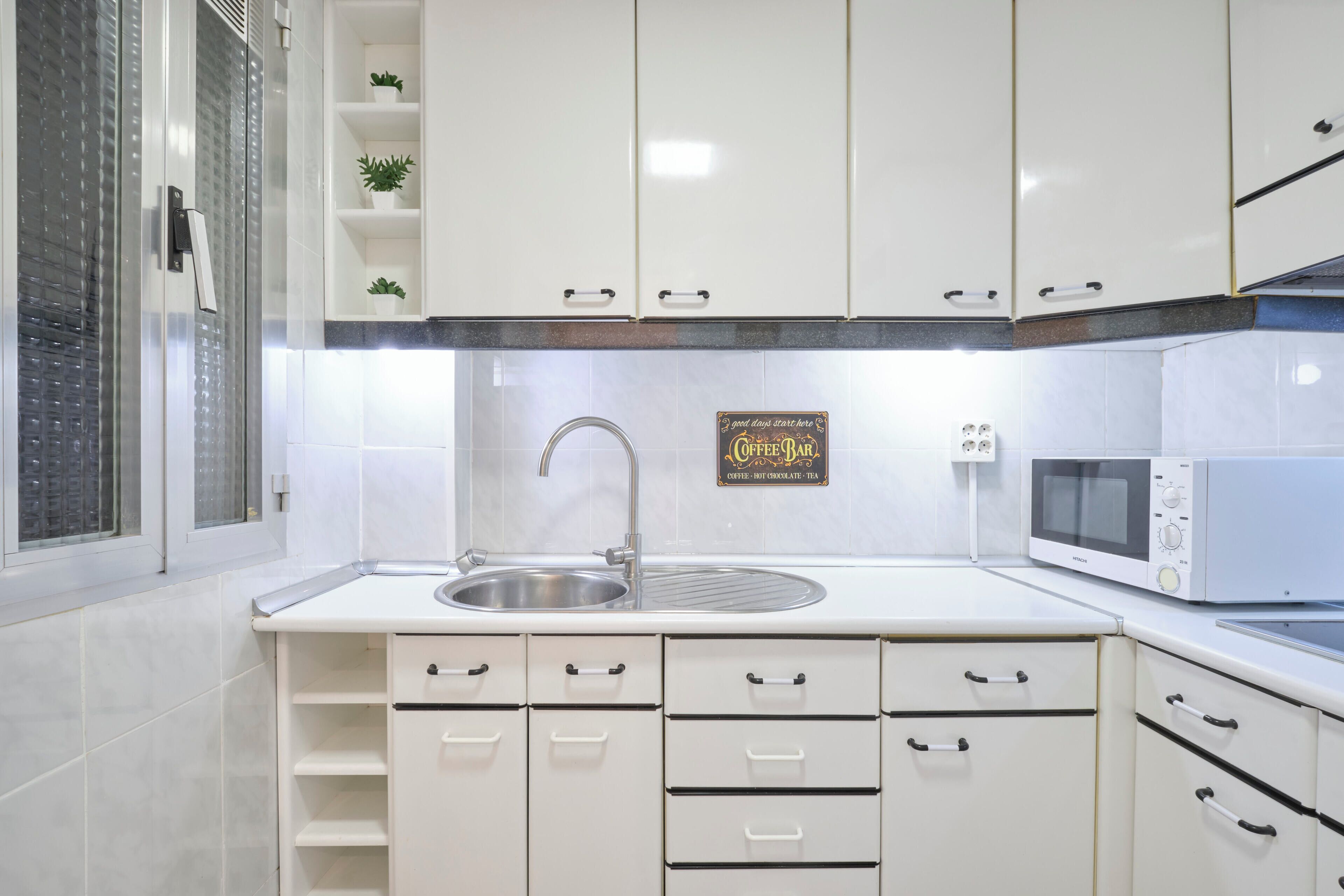 Fridge, microwave, stovetop, coffee/tea maker