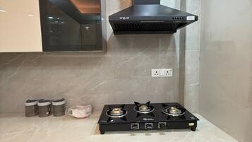 Full-sized fridge, microwave, cookware/dishes/utensils