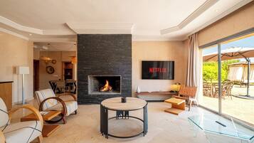50-inch flat-screen TV with satellite channels, Netflix