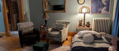 1 bedroom, desk, iron/ironing board, travel crib