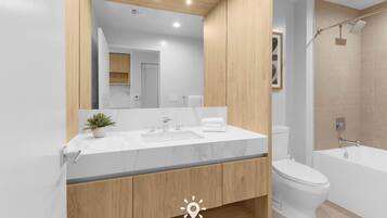 Shower, hair dryer, towels, shampoo