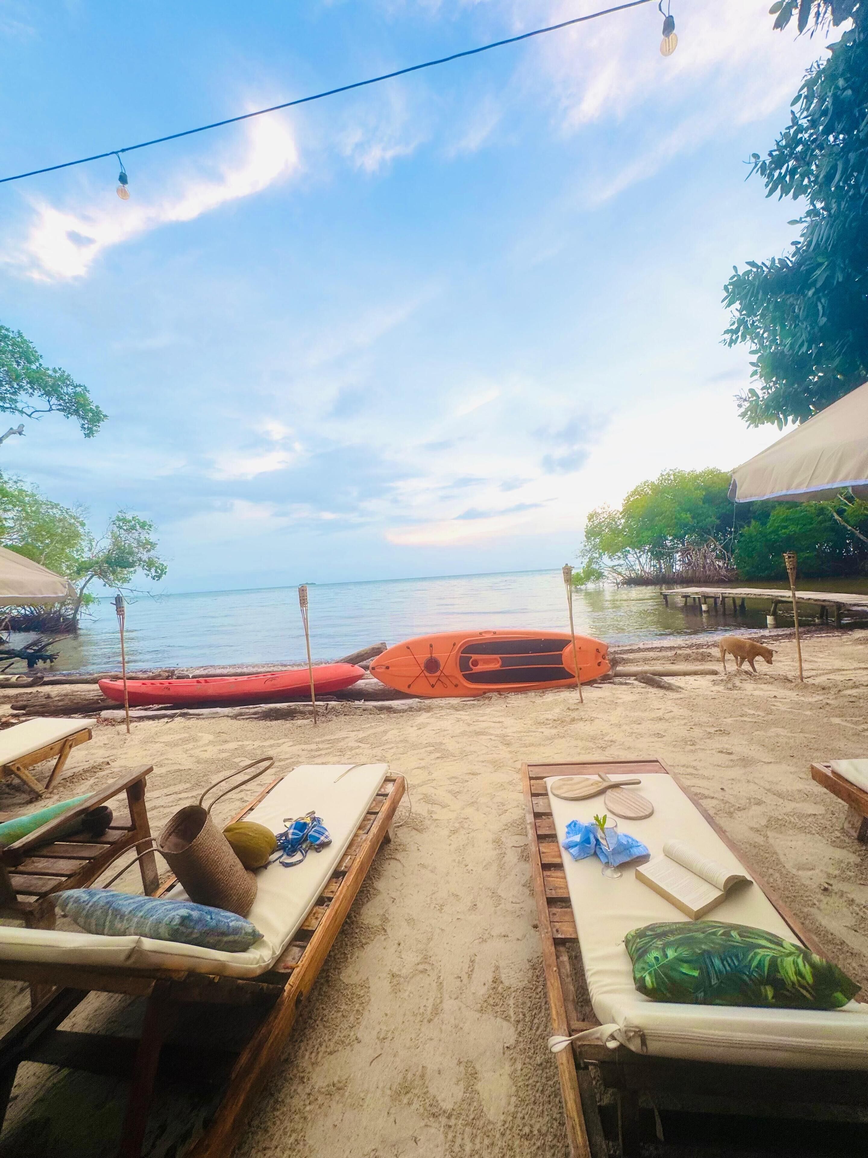 On the beach, black sand, beach shuttle, sun-loungers