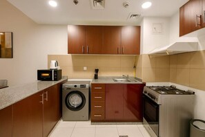 Fridge, microwave, oven, stovetop - Convenient Location in JVC Bright 1BR with Balcony (Dubai)
