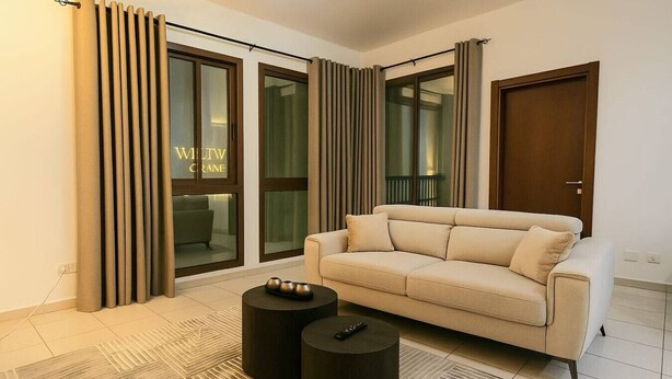 TV - Convenient Location in JVC Bright 1BR with Balcony (Dubai)