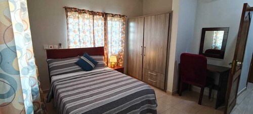 2-bedroom suite in delightful Elmina with AC, high speed internet. free parking.
