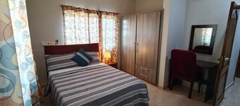 2-bedroom suite in delightful Elmina with AC, high speed internet. free parking.