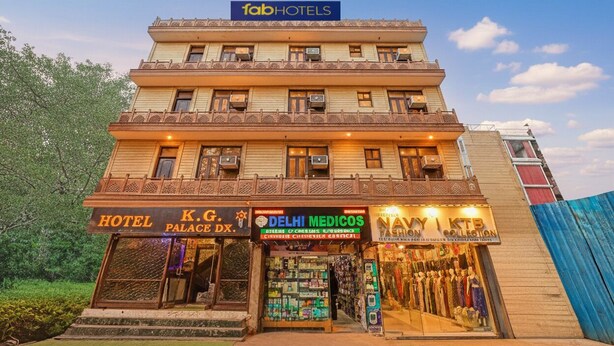 A multi-story building with a sign for 'fabHOTELS' at the top. - Fabhotel Kg Palace (New Delhi)
