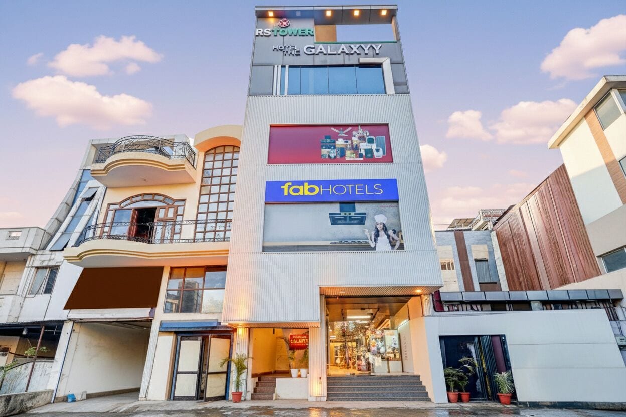 A hotel with a modern facade, including a sign for 'RSTOWER HOTEL THE GALAXY' and 'fabHOTELS'.