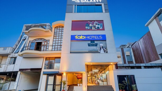 A hotel with a modern design, featuring a prominent sign for 'RSTOWER Hotel The Galaxy' and 'TabHotels'. - Fabhotel The Galaxy (Faridabad)