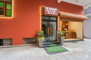 A hotel entrance with a sign reading "The Sehrawat Home Stay B&B". - Fabhotel Sehrawat (New Delhi)