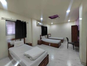 Egyptian cotton sheets, premium bedding, in-room safe, free WiFi - Fabhotel Chaitanya Inn (Rajgurunagar)