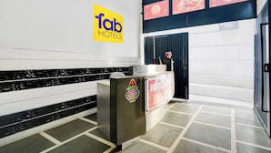 A reception area with a sign for 'Tab Hotels'. - Fabhotel Happy Stay I (Noida)