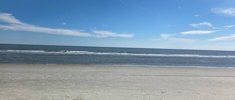 On the beach, sun-loungers