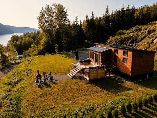 Rustic wooden chalet on the waterfront.