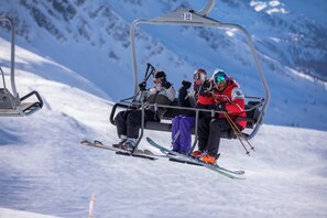 A ski lift with passengers.