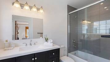 Shower, hair dryer, towels, toilet paper