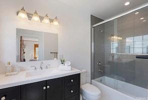 Shower, hair dryer, towels, toilet paper