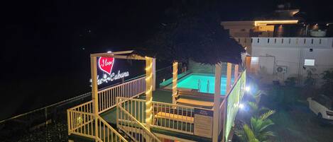 A pool area with a sign that reads "I Love the Cabana."