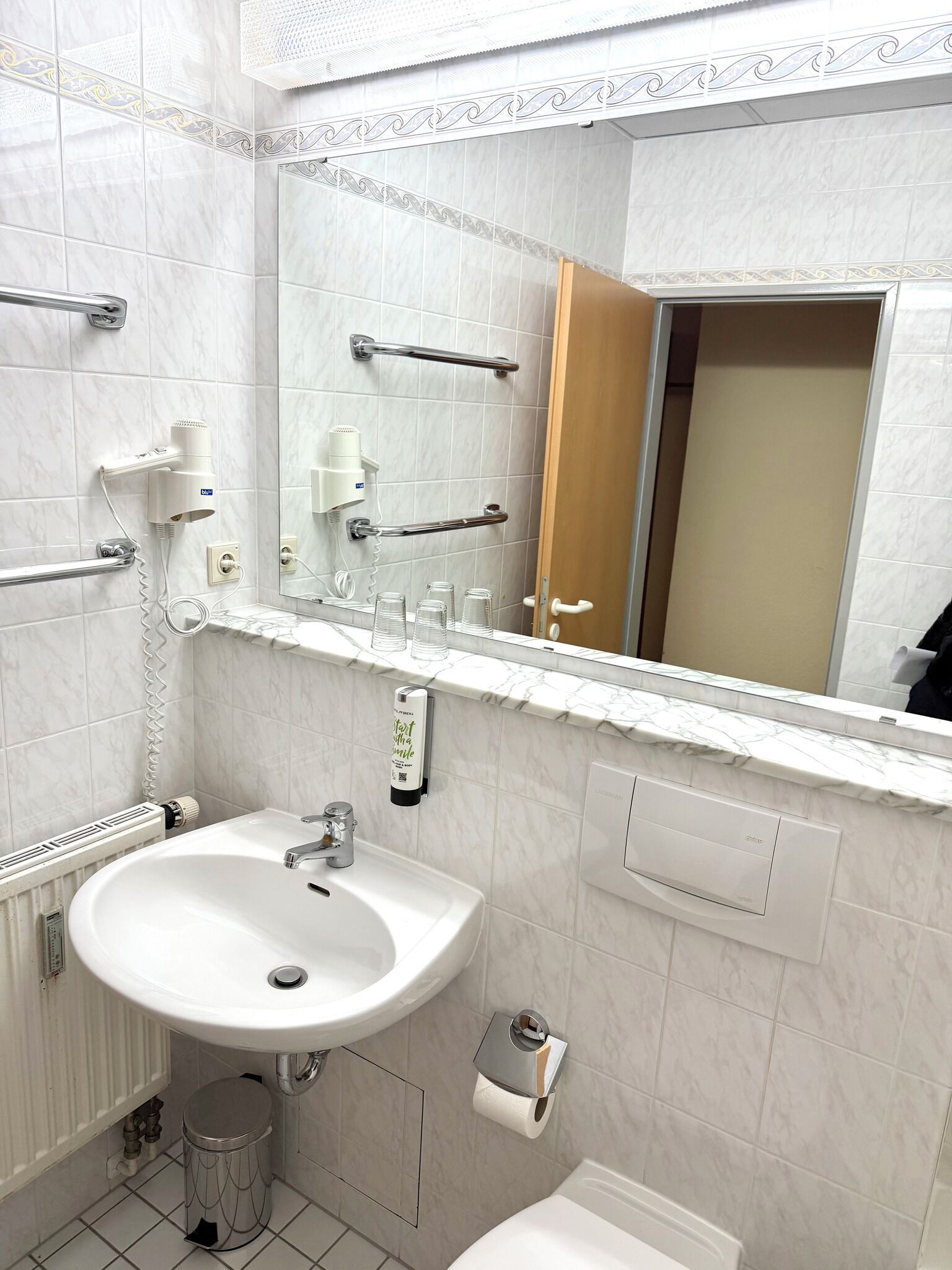 Hair dryer, slippers, towels, soap