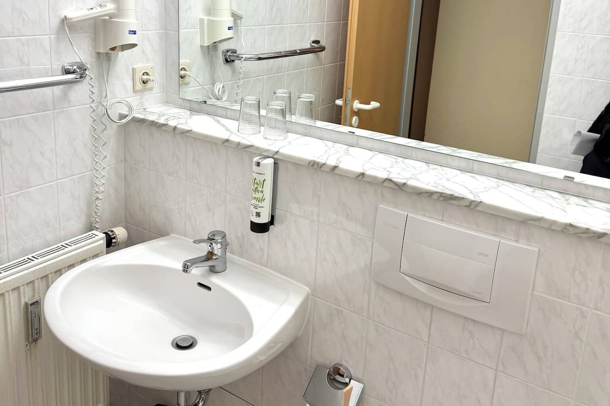 Hair dryer, slippers, towels, soap