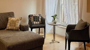 Luxury Apartment, City View | Living room | 65-inch Smart TV with digital channels