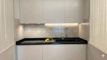 Deluxe Apartment, City View | Private kitchen | Fridge, microwave, stovetop, espresso maker