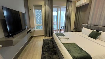 Standard Apartment, Balcony, Garden View | Desk, laptop workspace, blackout drapes, soundproofing