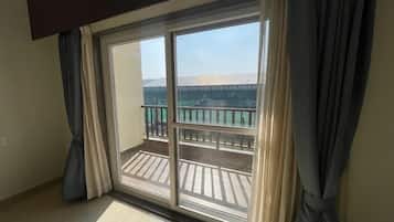 Desk, laptop workspace, blackout drapes, iron/ironing board