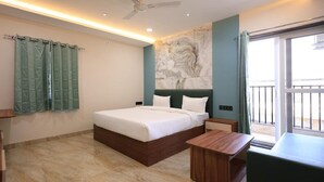 A modern hotel room with a large bed, a wooden nightstand, a marble floor, and a view of the outside balcony. - Hotel Anmol One  (Indore)