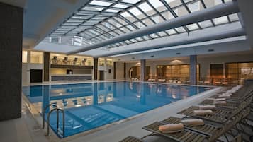Indoor pool, seasonal outdoor pool, pool umbrellas, pool loungers