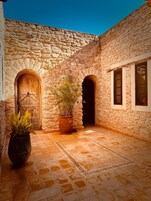 Deluxe Triple Room, Garden View | Property grounds