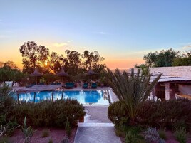 Outdoor pool, open 9:00 AM to 7:00 PM, pool umbrellas, sun loungers