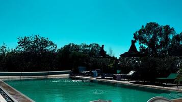 Outdoor pool, open 9:00 AM to 7:00 PM, pool umbrellas, sun loungers