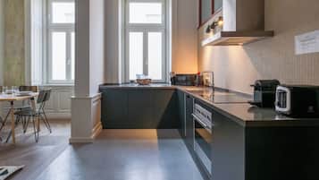 Apartment, City View | Private kitchen | Dining tables