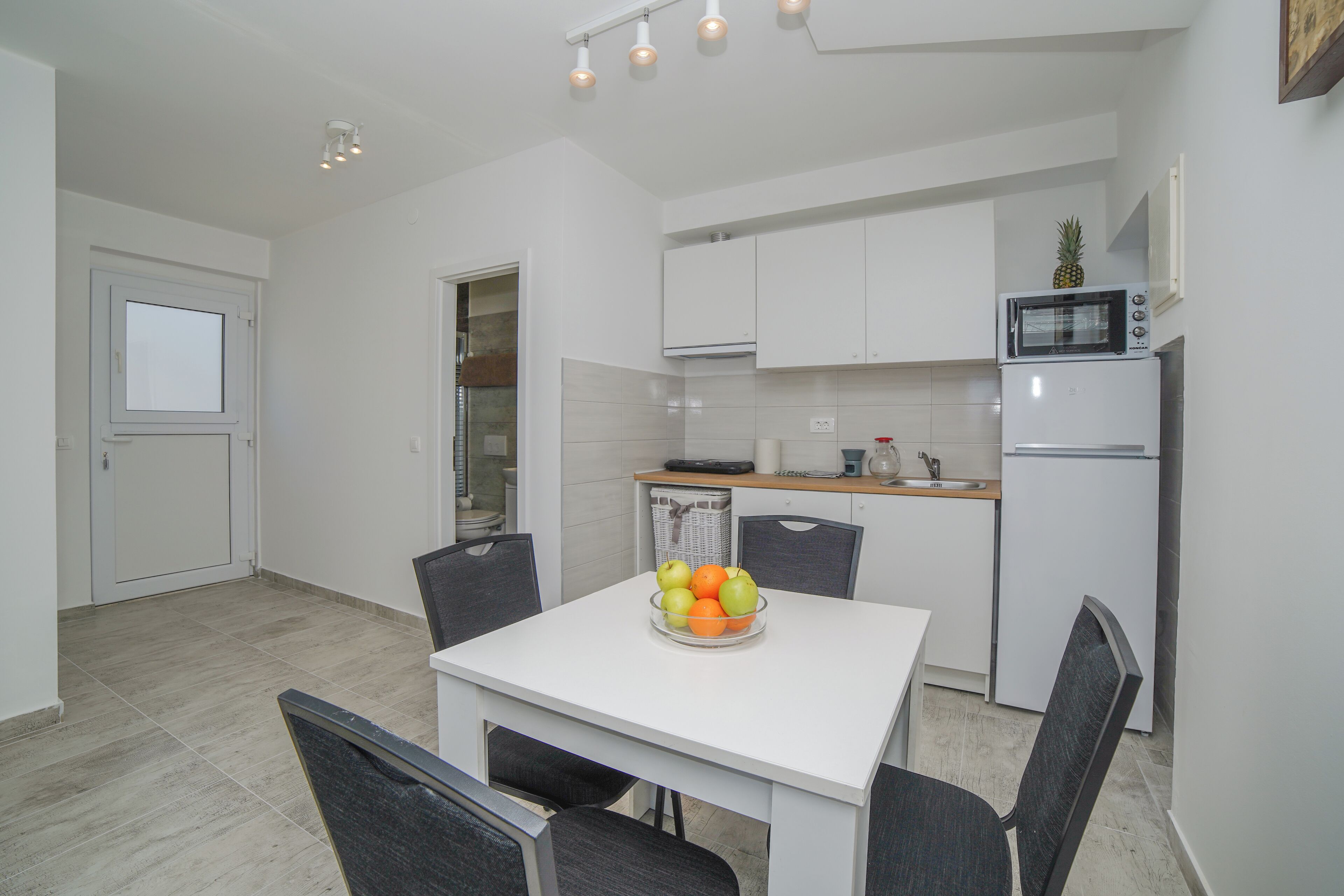 Apartment, Balcony, Sea View | Private kitchen | Dining tables