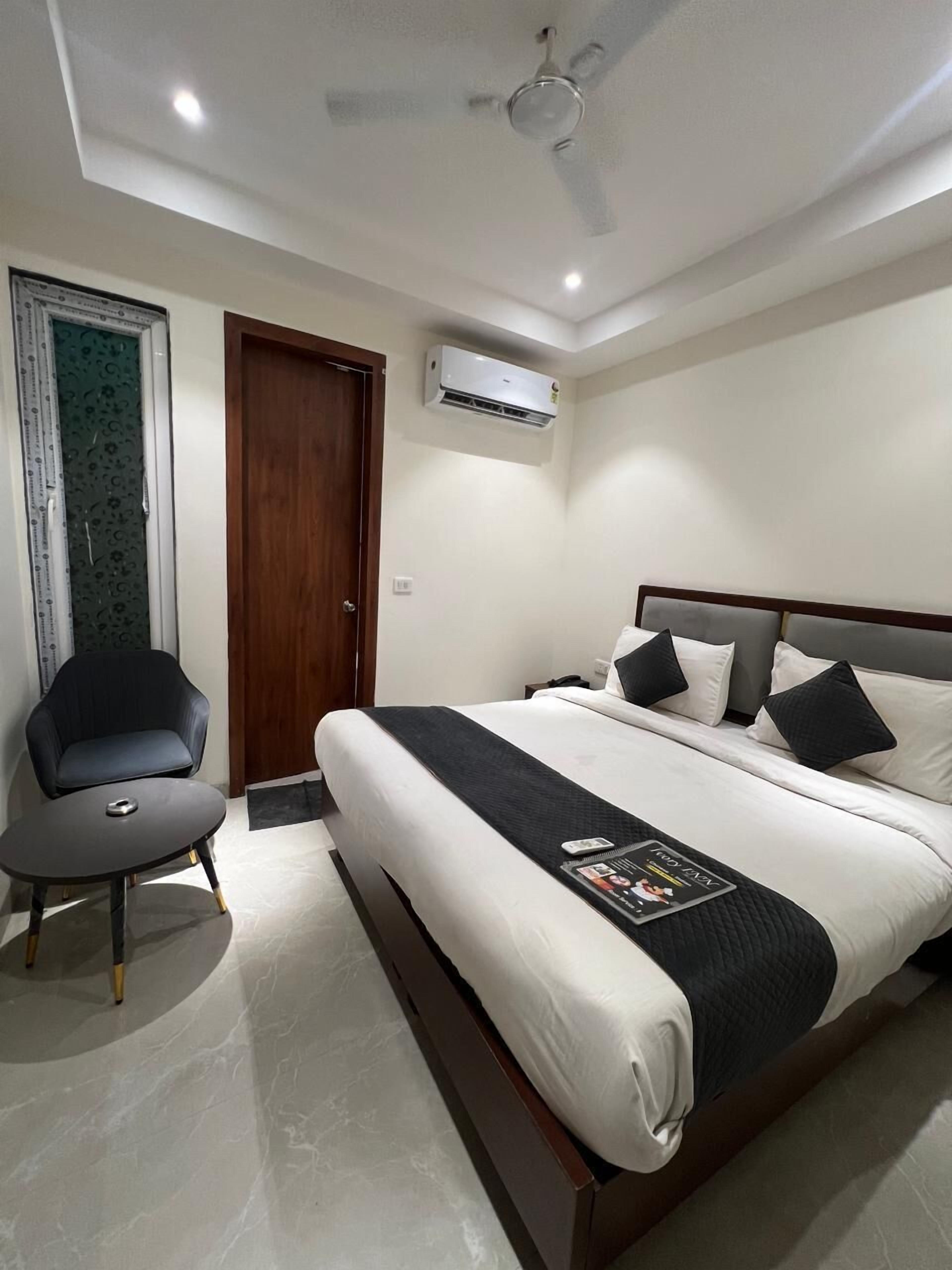 Quarto casal luxo, vista para a cidade | Camas Select Comfort, escrivaninha, Wi-Fi de cortesia, roupa de cama