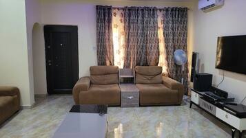 Chambre Deluxe, balcon, vue ville | Coin séjour