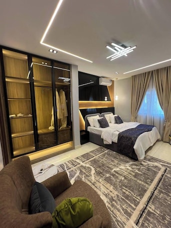 Deluxe Room, Balcony, City View | Desk, laptop workspace, blackout drapes, soundproofing. Tazu Luxury Hotel and Suites