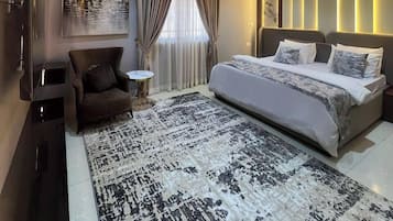 Deluxe Room, Balcony, City View | Desk, laptop workspace, blackout drapes, soundproofing