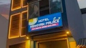 A multi-story hotel with a prominent sign reading "HOTEL NIDHAVIR PALACE". - Hotel Nidhivan Palace  (Surat)