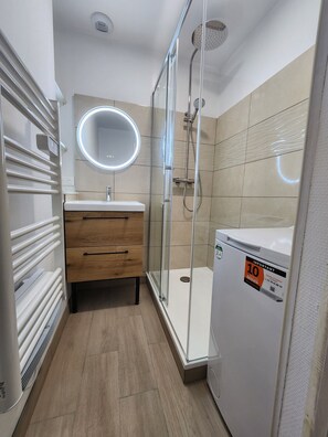 Shower, hair dryer, towels, soap