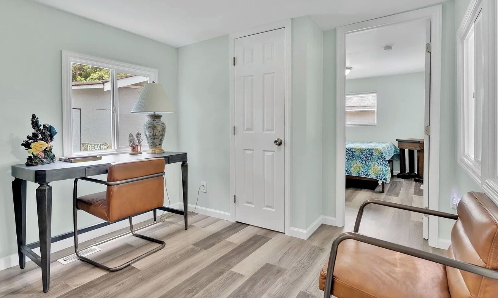 Peaceful and sunlit home office - the perfect spot to work remotely, plan your beach day, or unwind with a good book.