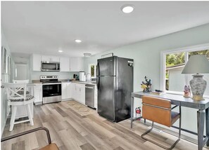 Fridge, microwave, oven, stovetop - Cozy Coastal Cottage - 5 Min to Holden Beach (Supply)