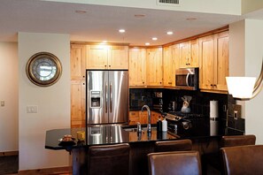 Fridge, microwave, oven, stovetop - Creekside 2-Bedroom Mountain View (Canmore)