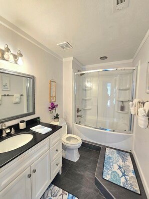 Shower, hair dryer, towels, soap