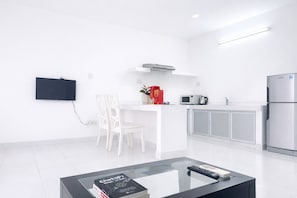 Standard Studio, City View | Private kitchen | Mini-fridge, stovetop, cookware/dishes/utensils, dining tables - HD Garden Thu Dau Mot (Thu Dau Mot)